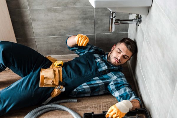 bearded-handyman-lying-on-floor-near-toolbox-in-ba-resize.jpg